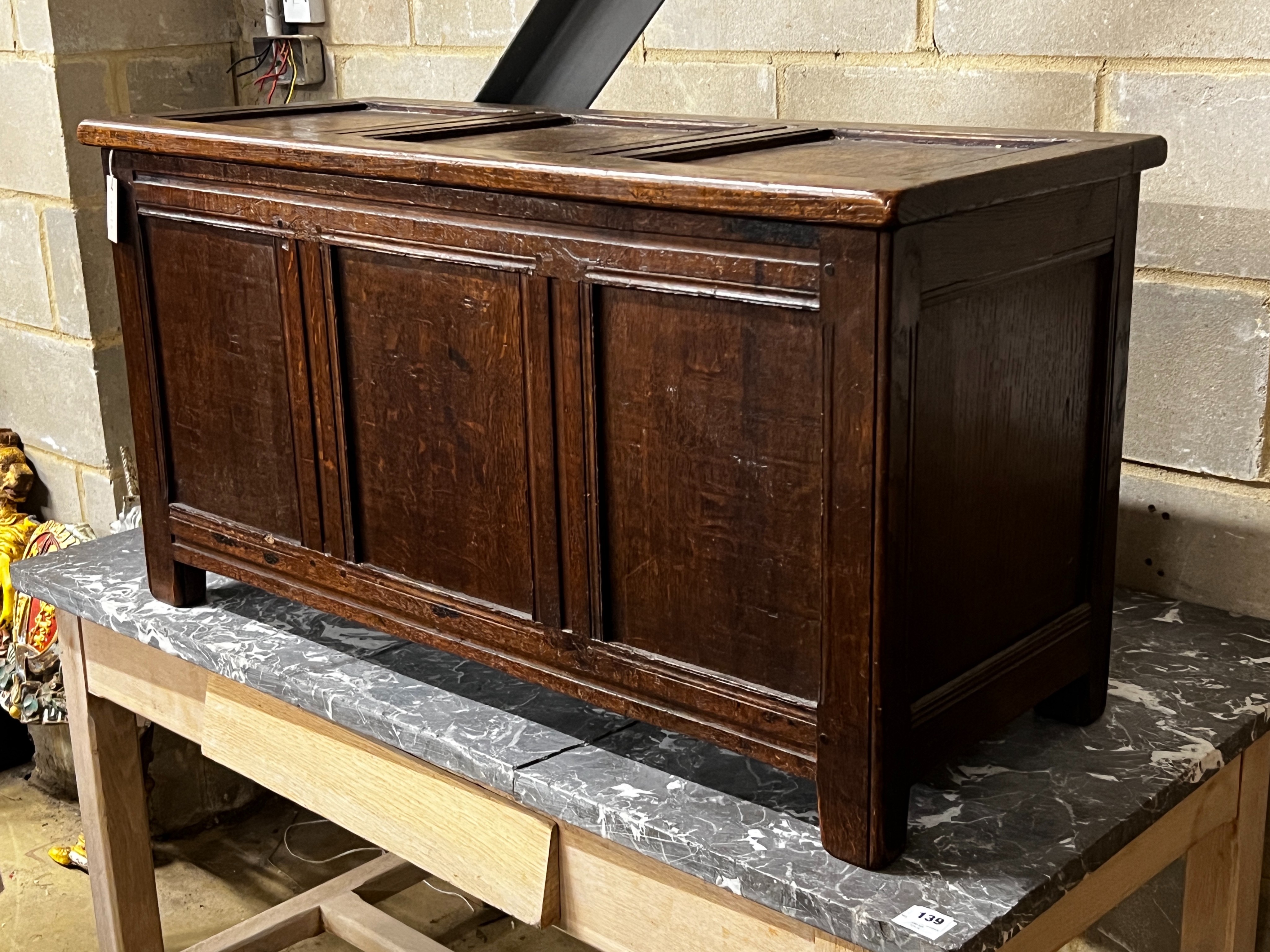 An early 18th century and later panelled oak coffer, length 108cm, depth 43cm, height 57cm